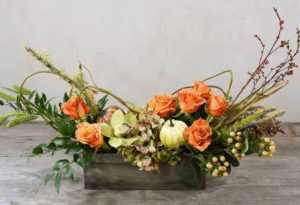 orange roses with fall accents