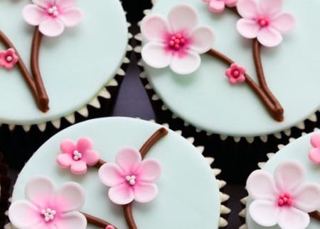 Petite cupcakes with pink flower decoration