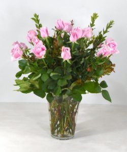 Blushing pink roses will make your love do the same. Our roses are accented with lovely green foliage in a glass vase will make anyone’s heart melt. Foliage and vase may vary depending on availability.