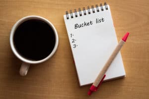 Bucket List with coffee and red pen