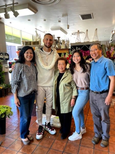 Steph Curry with Ah Sam's Lori Leong and her family